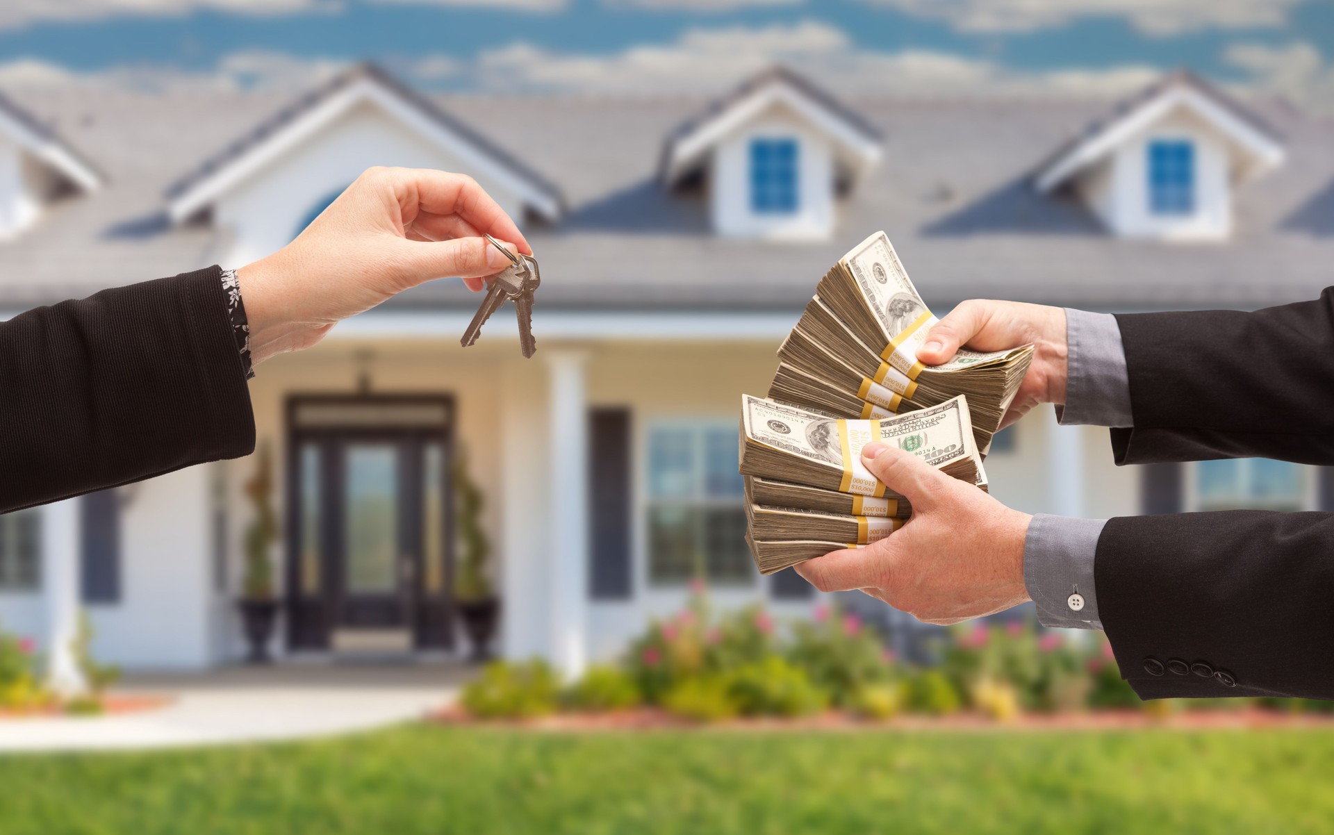 Real Estate Agent Handing Over House Keys for Stacks of Money in Front of New House.